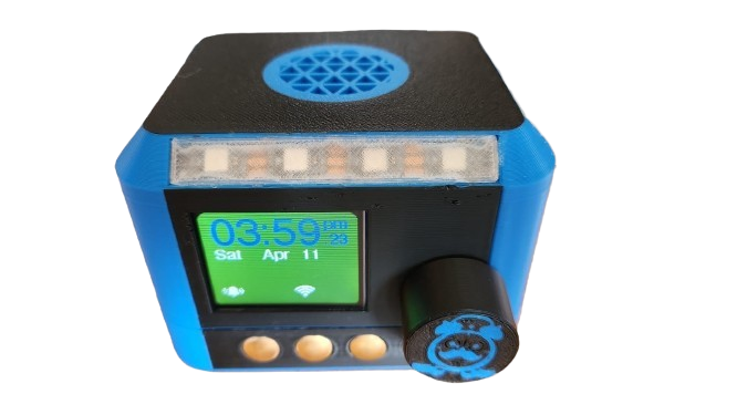 The Klever Klox V2 alarm clock, showing the time on its colour display